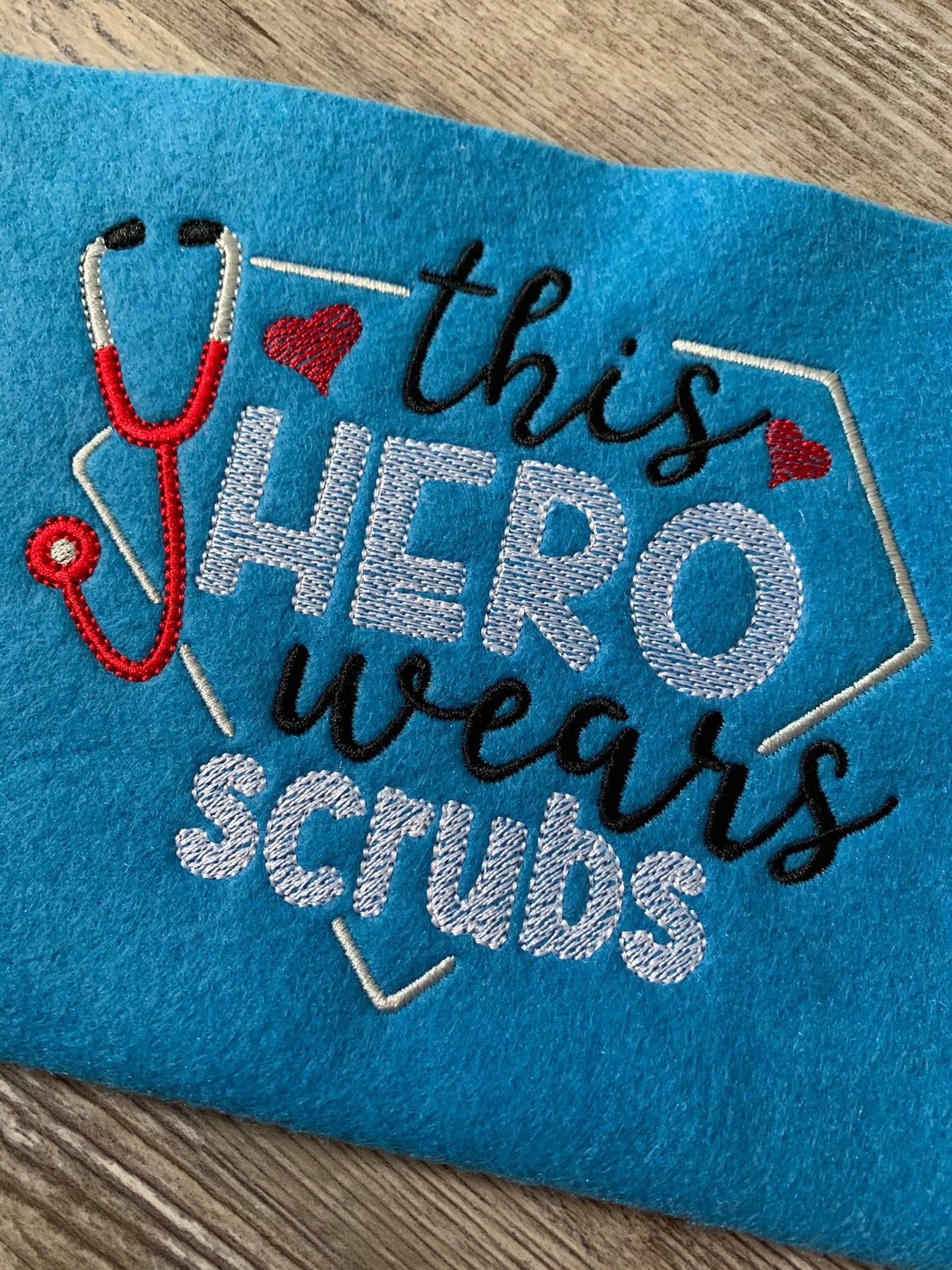 This hero wears scrubs - 3 Sizes - Digital Embroidery Design